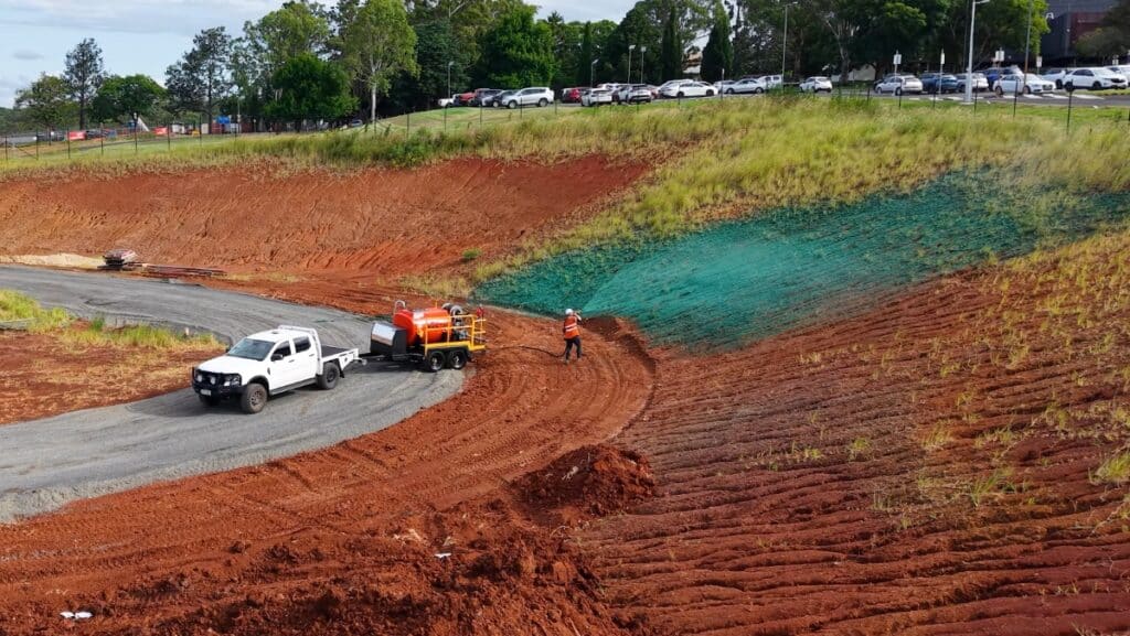 5 Key Considerations When Starting a Hydroseeding Business 9 Aerial view of an operator starting a Hydroseeding Business by spraying land with a Vortec hydroseeder